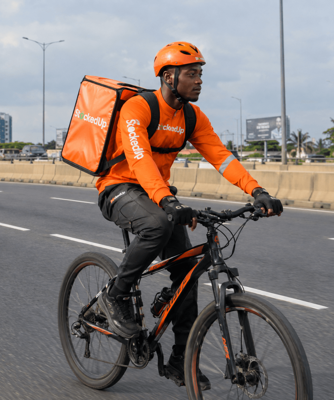 A KoulriaGo rider with an orange delivery bag